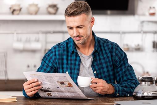 Man reading newspaper