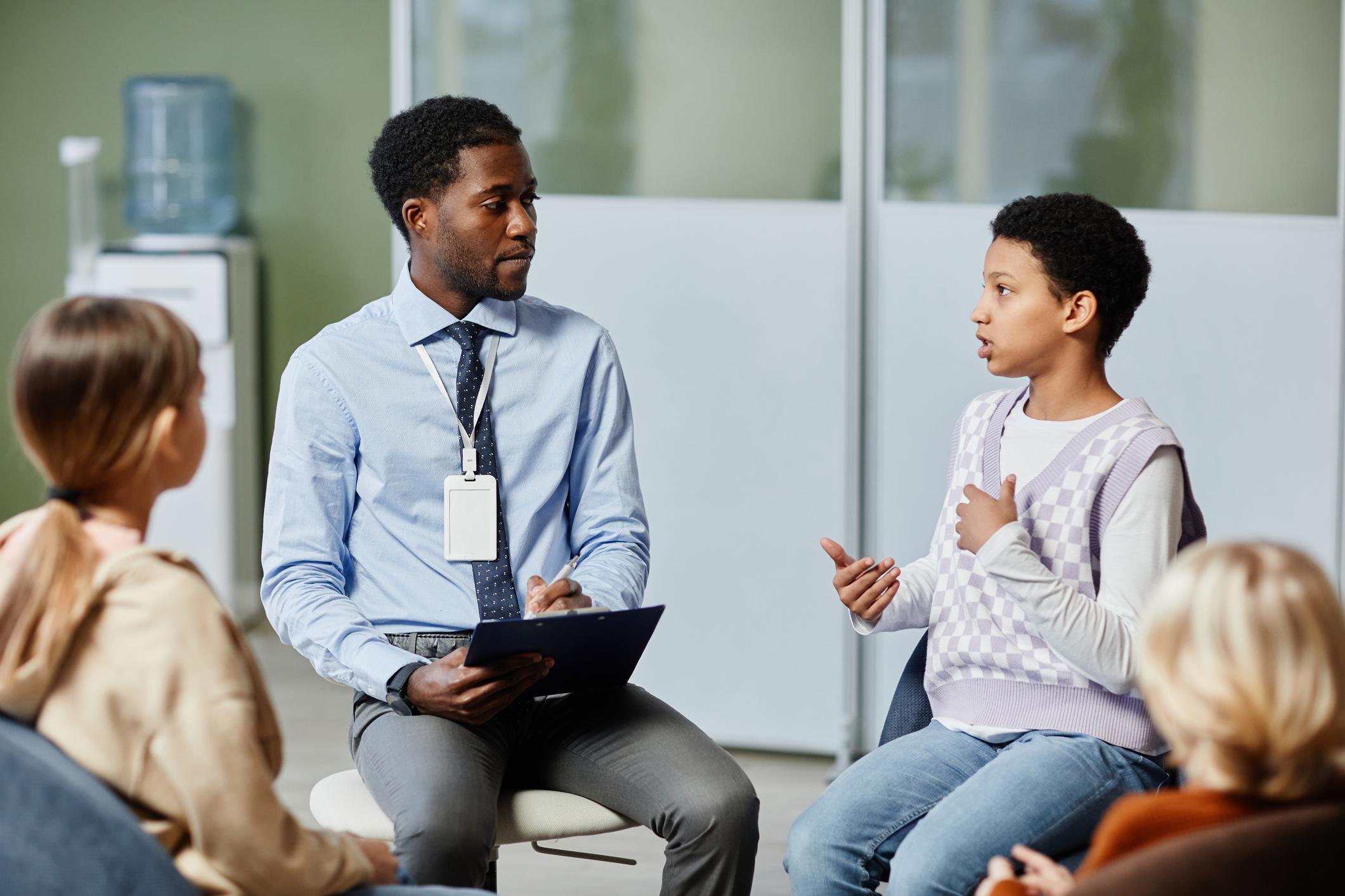 teacher talking with students